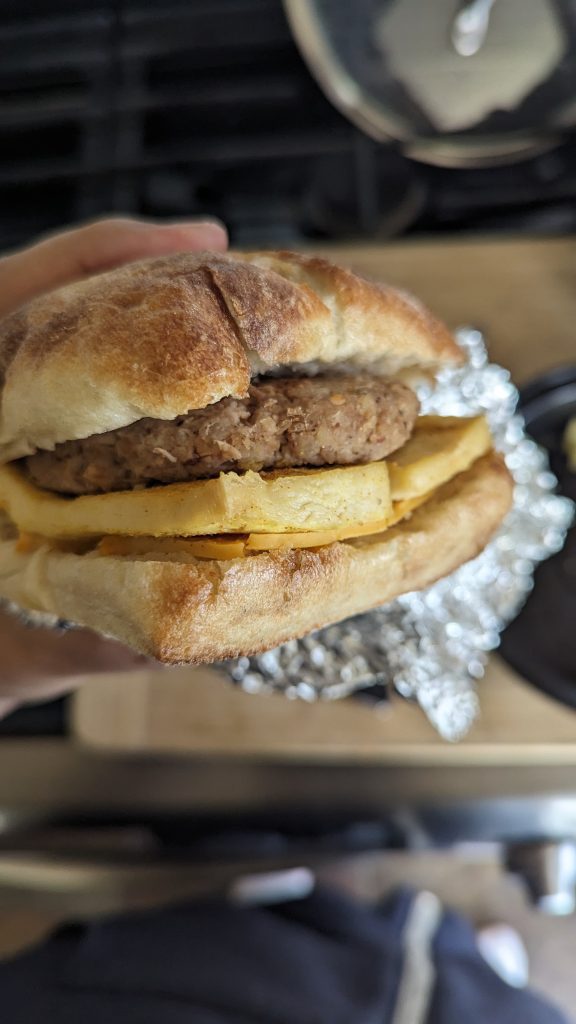plant-based, oil-free sausage, tofu egg, and Canyon Cheddar breakfast sandwich